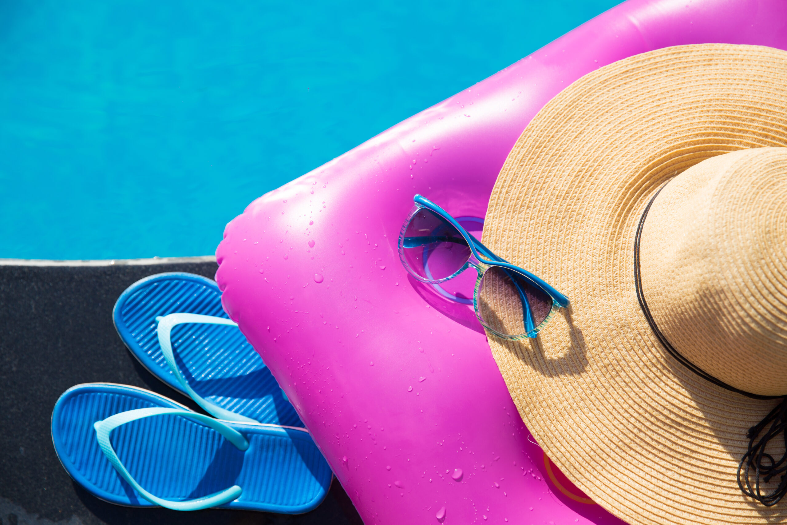 slippers sunglasses straw hat pink air mattress